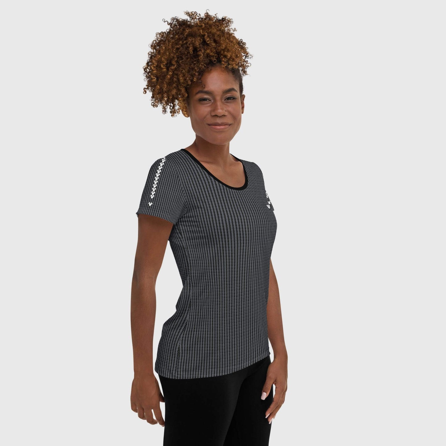 female model wearing CRiZ AMOR's Heart Sport Shirt, a Black Shirt with a White Heart for Active Women