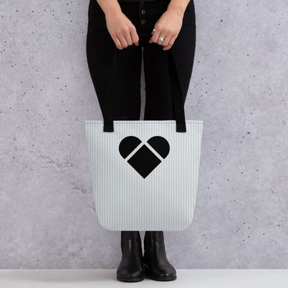 A light gray tote bag with a playful lovogram pattern