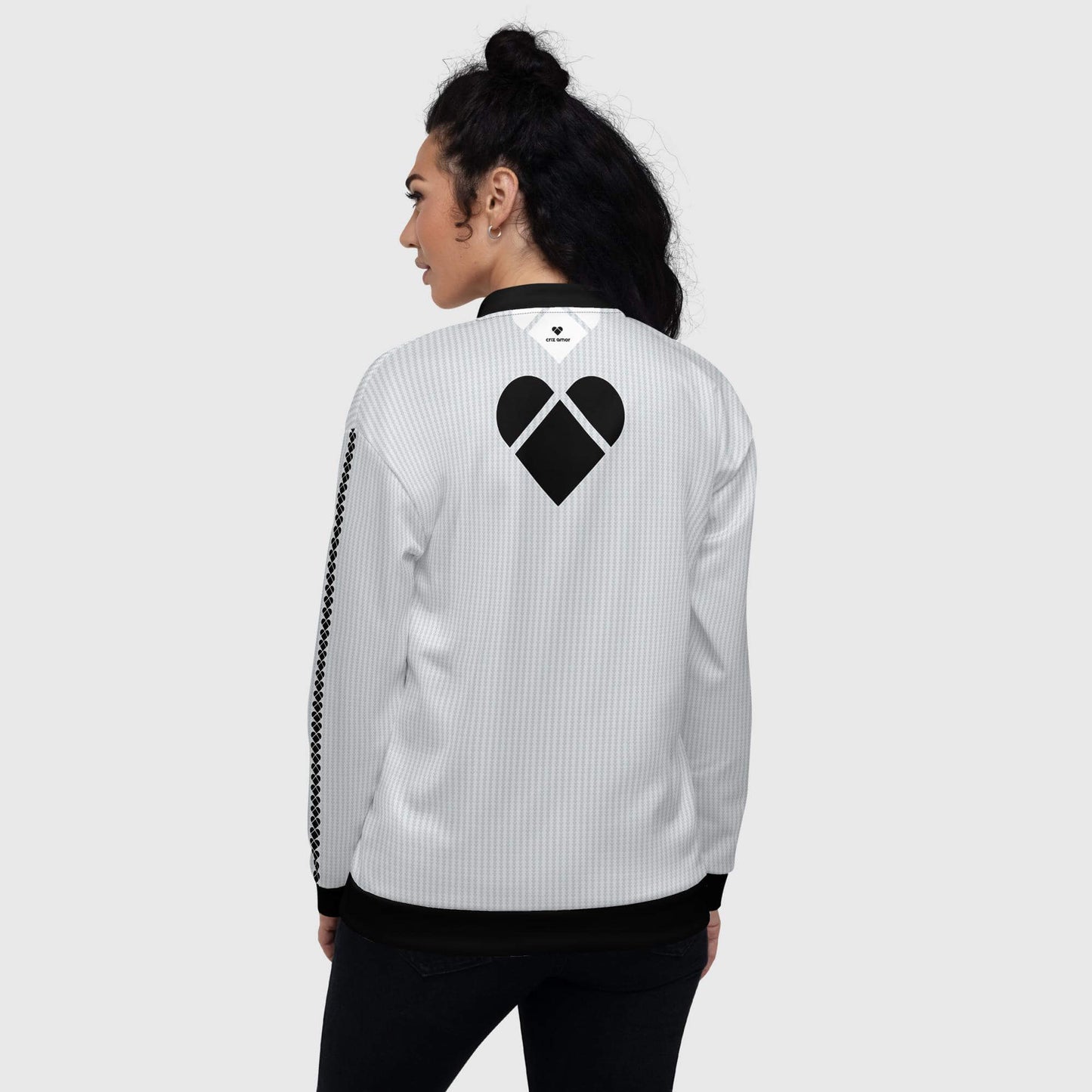 A light gray bomber jacket with a unique 'Dualshade lovogram' pattern and black heart logo by CRiZ AMOR, female model back view