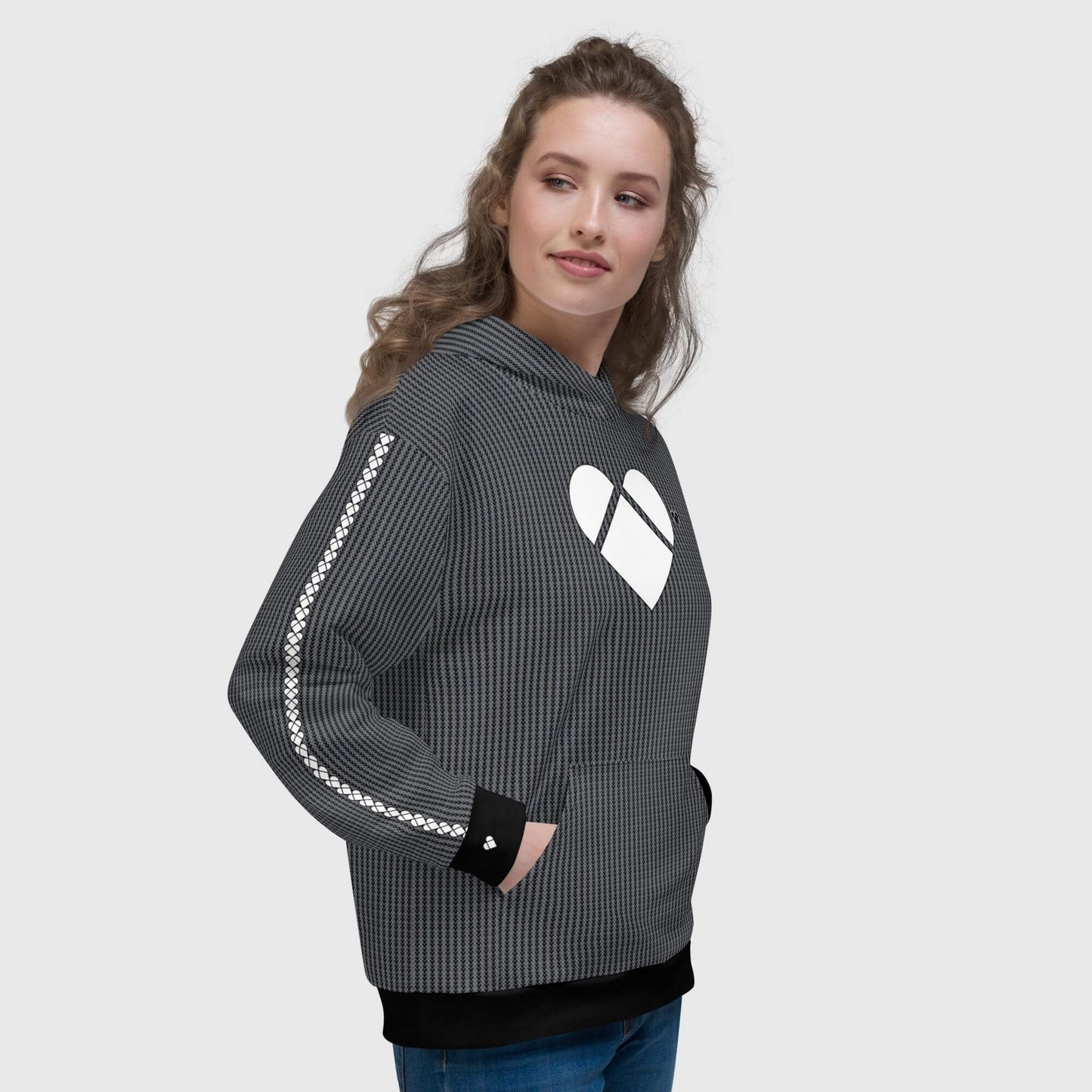 female model wearing a soft cotton-feel face with brushed fleece black hoodie, featuring a dual-shade heart-shaped geometrical pattern