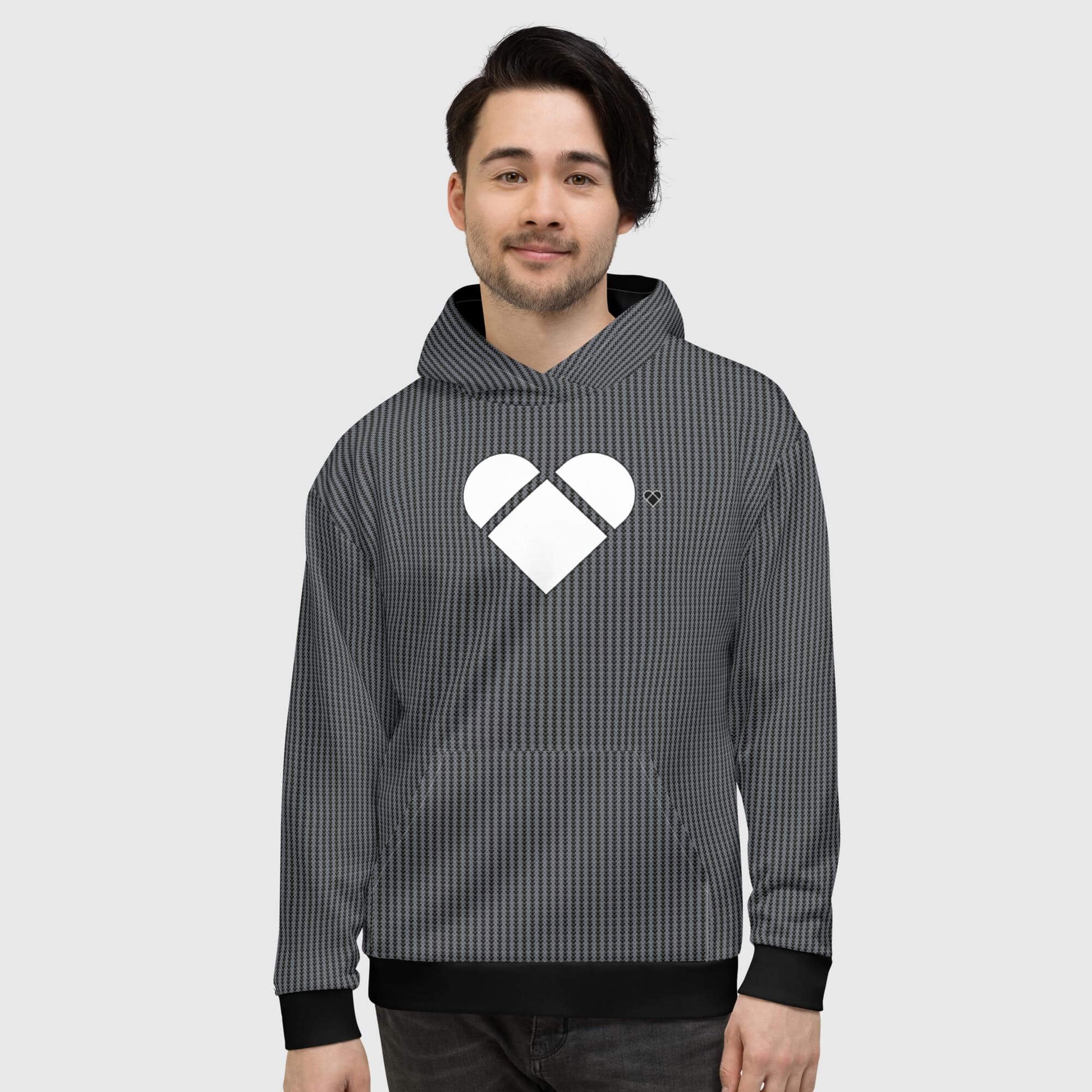 male model wearing A soft cotton-feel face with brushed fleece black hoodie, featuring a dual-shade heart-shaped geometrical pattern