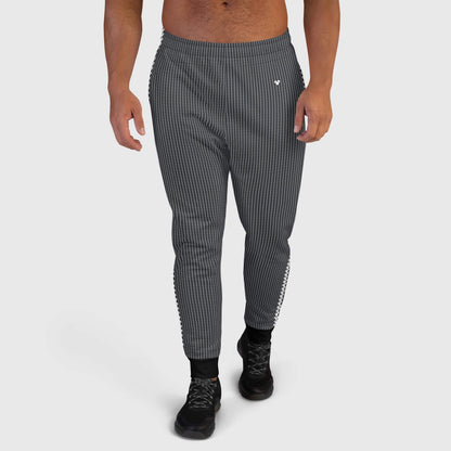Men's black joggers with a brand heart logo and black details on leg cuffs, model men front