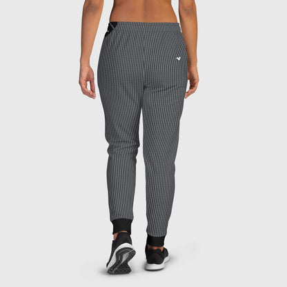A pair of black joggers for women, made with soft cotton and brushed fleece inside, featuring a unique Dualshade Lovogram pattern and practical pockets, perfect for a cozy day in or a casual day out