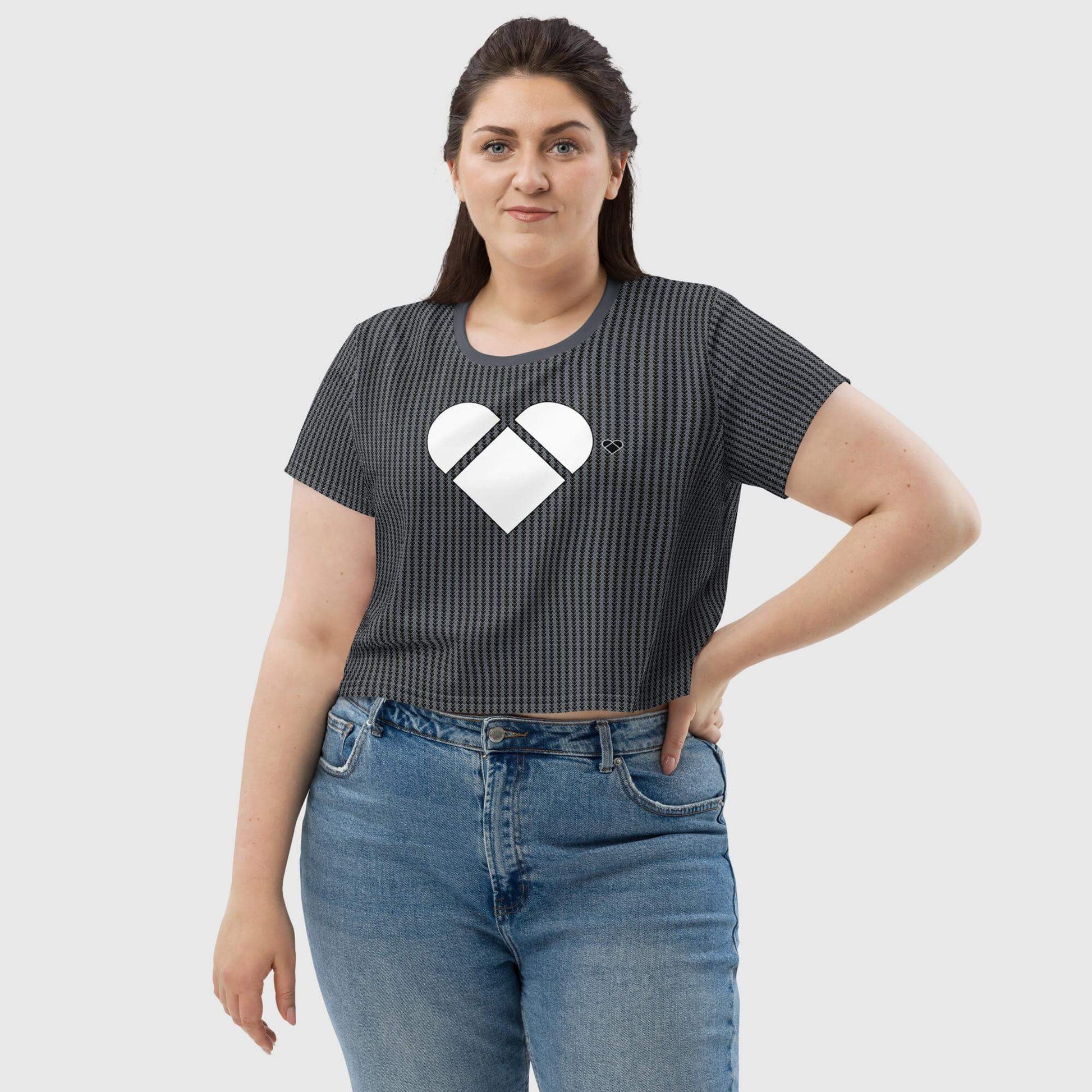 omen's Black Crop Tee with a unique pattern of little heart-shaped geometrical logos and a big white heart in front from the Amor Primero collection by CRiZ AMOR, front view
