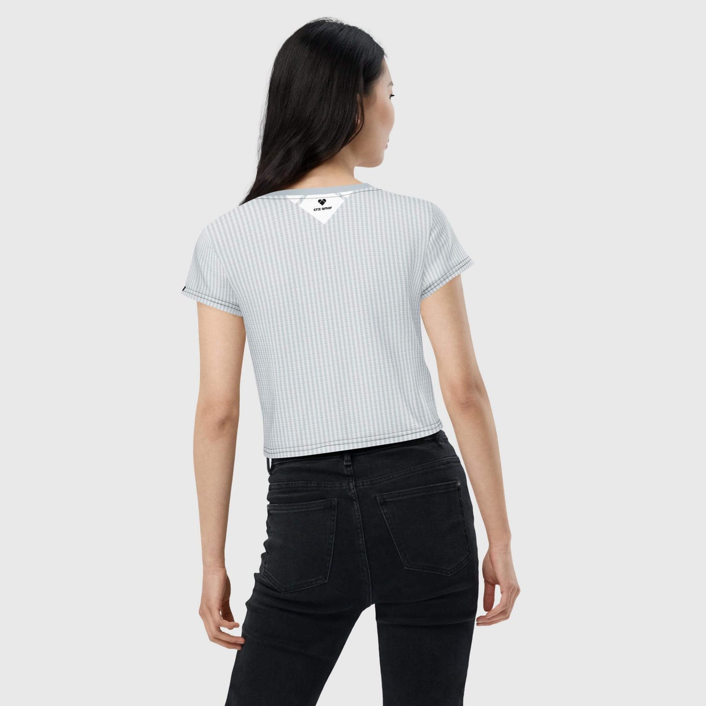 model back Light gray crop tee with black heart and big white heart on the front, symbolizing love and positivity