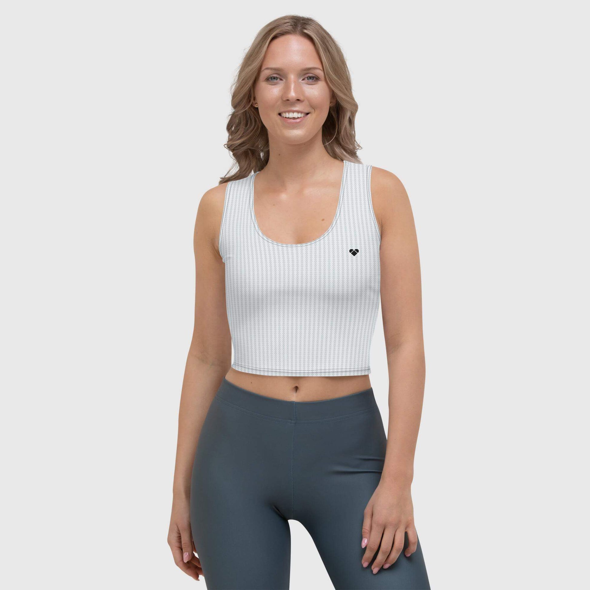 female model wearing lovogram heart crop top for women, perfect for sporty and sassy looks.