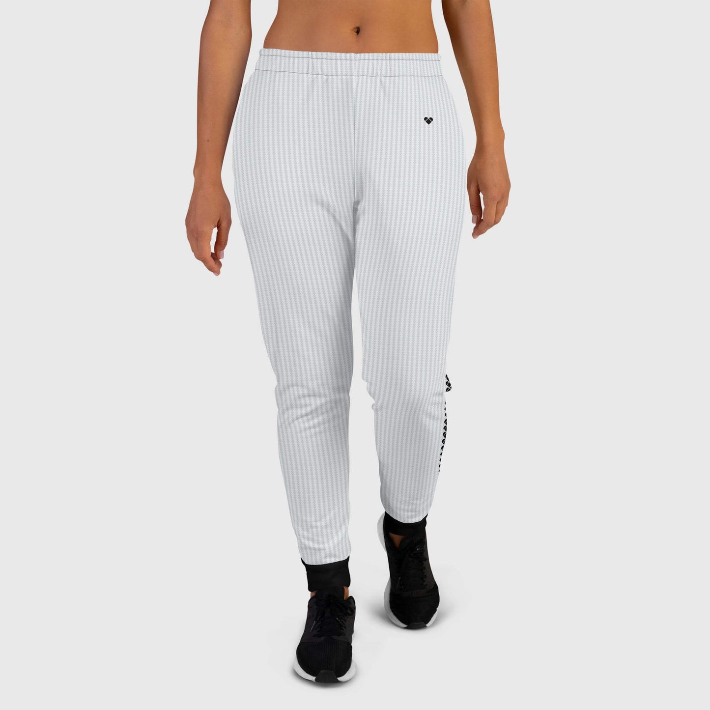 front view of Chill wear light gray joggers with a heart-shaped geometric pattern and black details on the leg cuffs for women from CRiZ AMOR's Amor Primero collection