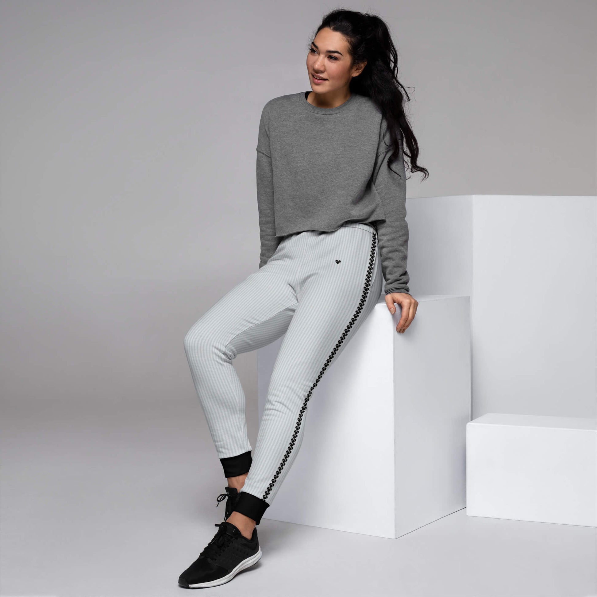model wearing Fashion-forward light gray joggers for women with Hearts Stripe design by Amor Primero