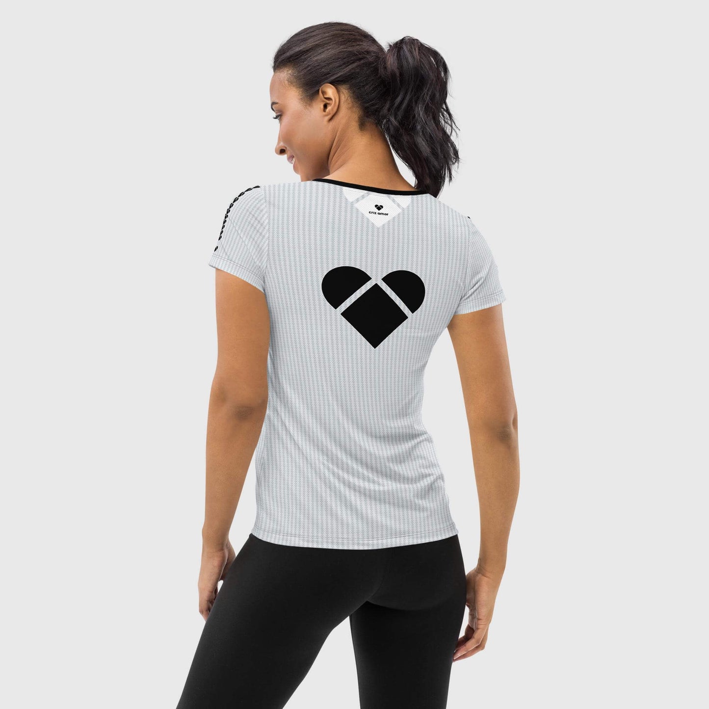 model wearing Women's light gray sport shirt with black heart and logo stripe on sleeves from CRiZ AMOR's Amor Primero collection