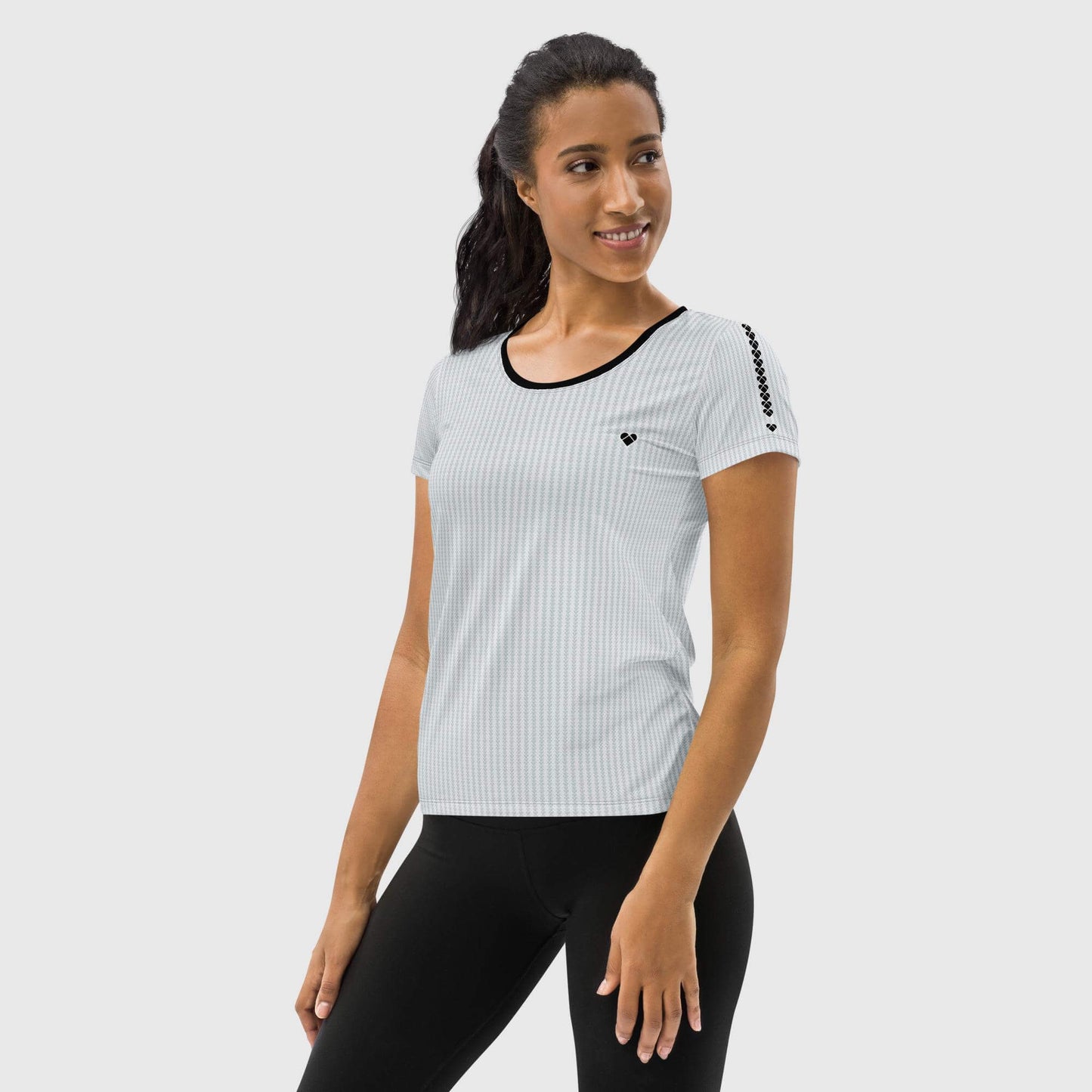 girl model wearing Sport shirt for gym enthusiasts with light gray dualshade lovogram pattern and big black heart from CRiZ AMOR's Amor Primero capsule collection