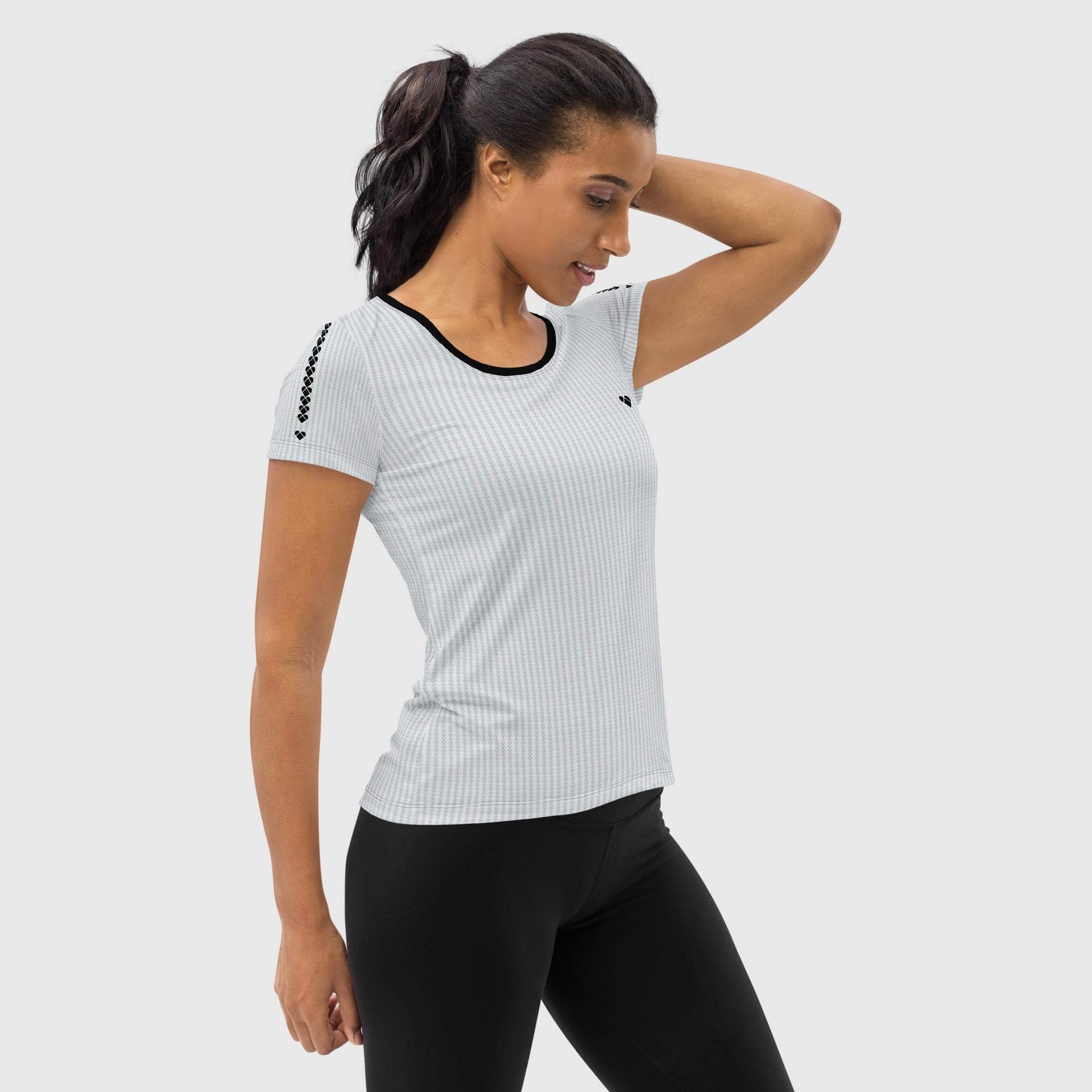 girl model wearing Light gray gym shirt with black heart and logo stripe on sleeves side view