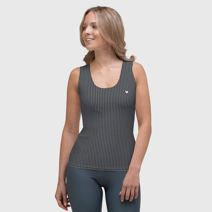 A woman wearing a black tank top with a white heart logo on the back, part of the Amor Primero capsule collection by CRiZ AMOR